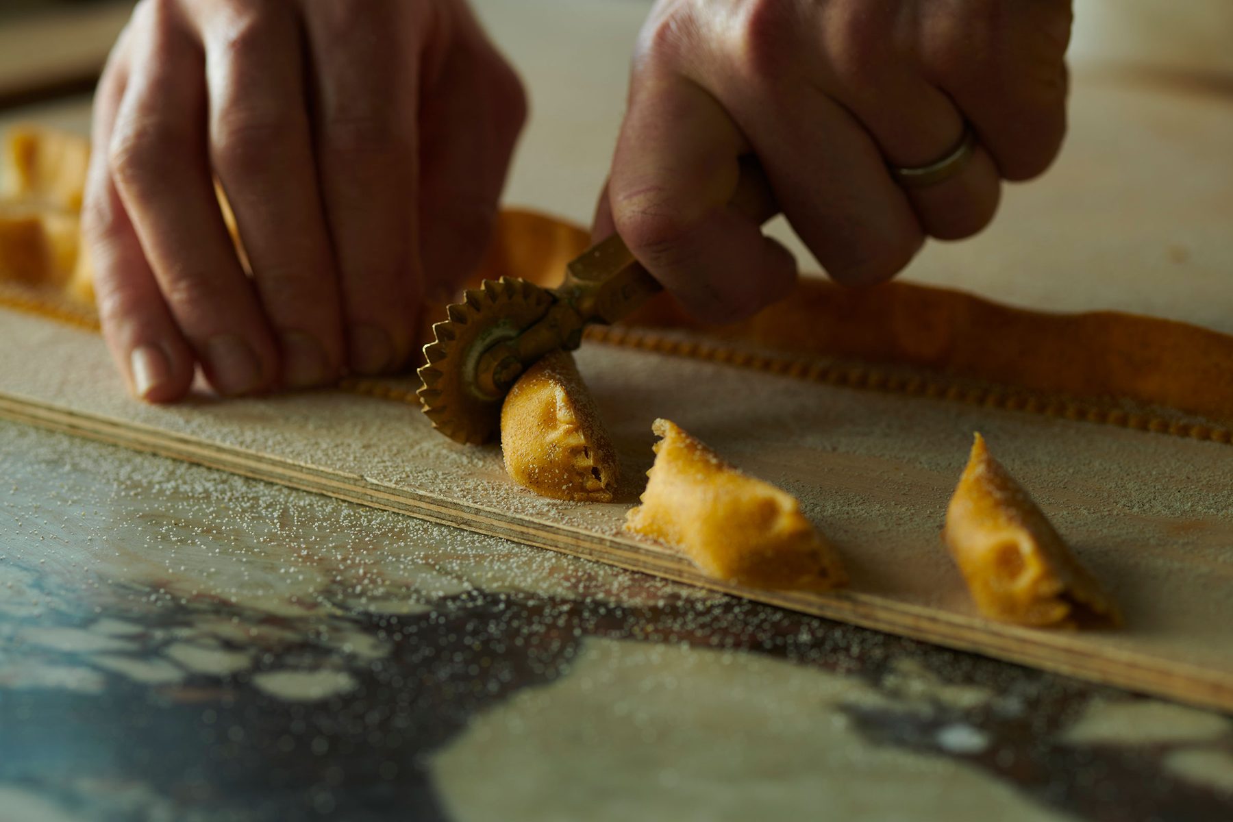 Fresh pasta being cut by hand in the Celentano&rsquo;s kitchen